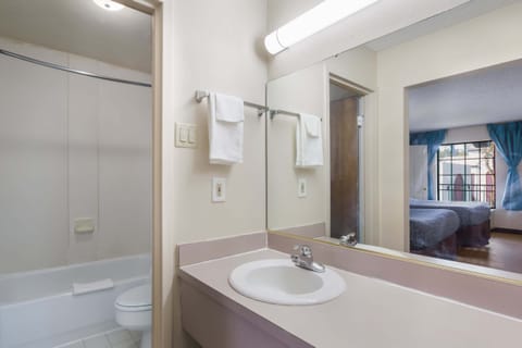 Suite, 2 Queen Beds, Kitchen | Bathroom | Combined shower/tub, hair dryer, towels