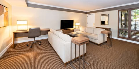 Suite, 1 King Bed (Ambassador, Agave) | Living area | LCD TV, iPod dock