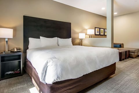 Desk, laptop workspace, blackout drapes, iron/ironing board