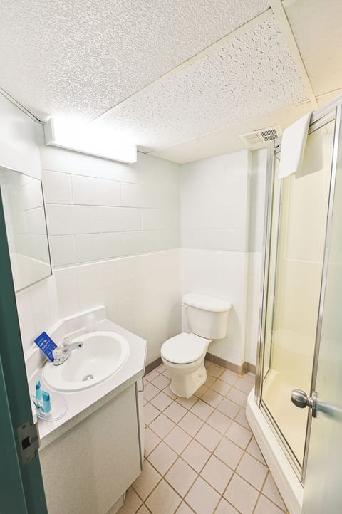 Basic Suite, 2 Bedrooms, Kitchenette | Bathroom | Shower, free toiletries, hair dryer, towels