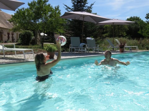Seasonal outdoor pool, open 10:00 AM to 7:00 PM, pool umbrellas