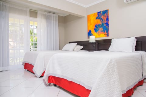 Junior Suite, 1 Bedroom, Ocean View | Desk, blackout drapes, iron/ironing board, bed sheets