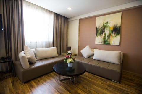 Suite, 1 Queen Bed with Sofa bed | Living area | Flat-screen TV