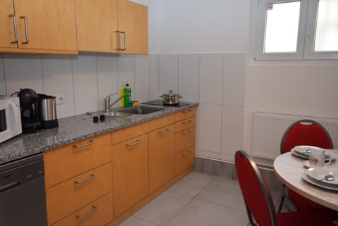 Apartment, 2 Bedrooms (101-00) | Private kitchen | Fridge, stovetop, dishwasher, coffee/tea maker