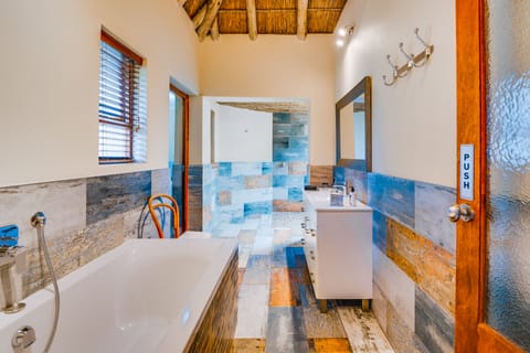 Luxury Suite, 2 Bedrooms | Bathroom | Separate tub and shower, deep soaking tub, free toiletries, hair dryer