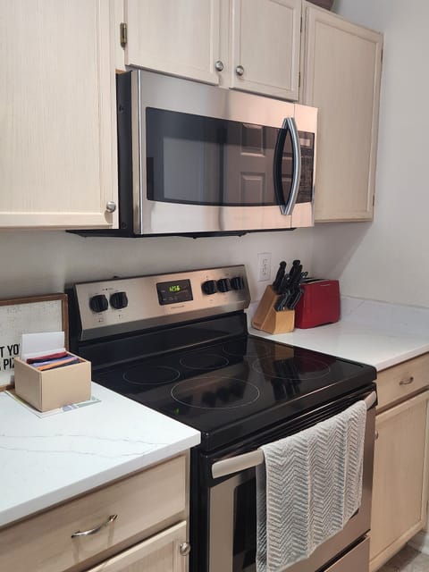 Kitchen range, microwave, and oven.
