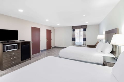 Deluxe Suite, Multiple Beds, Non Smoking | In-room safe, desk, blackout drapes, iron/ironing board