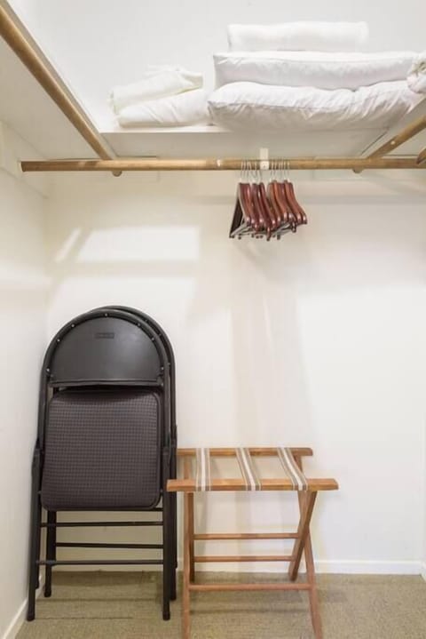 Walk-in closet with luggage rack, extra chairs for the dining table, cotton blankets for the beds and linens for the pull out couch.