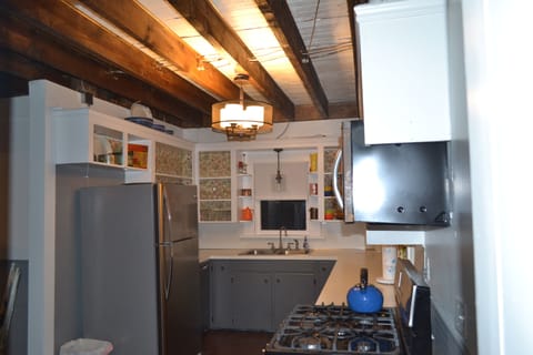 well stocked, updated kitchen with rustic charm
