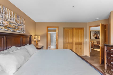 The second master bedroom is upstairs and features a king-sized bed and a flat screen TV.