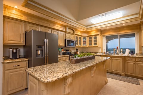 Nice large middle island with lots of storage and fully stocked kitchen.