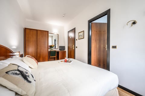 Economy Double Room, 1 Queen Bed | Minibar, in-room safe, desk, laptop workspace