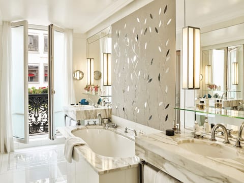 Suite (Eiffel) | Bathroom | Combined shower/tub, eco-friendly toiletries, hair dryer, bathrobes