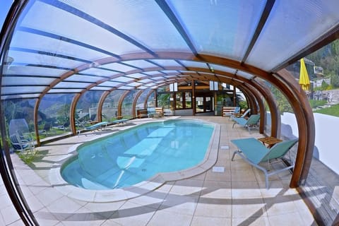 Indoor pool, open 8 AM to 10 PM, pool umbrellas, sun loungers