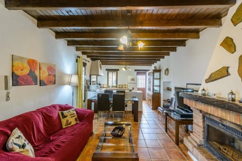 Enjoy the living room of this house with fireplace in Alhaurín el Grande
