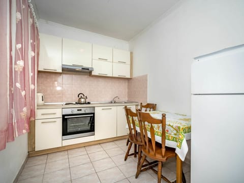 Cabinetry, Countertop, Furniture, Kitchen Stove, Kitchen, Kitchen Appliance, Building, Wood, Interior Design, Flooring