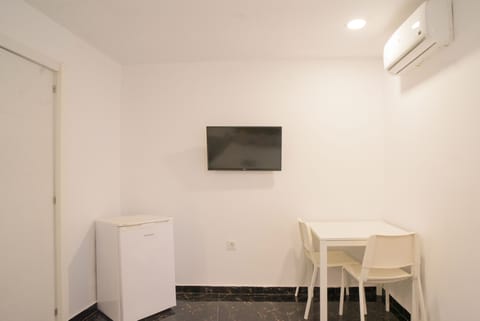 Standard Double Room | Living area | Flat-screen TV