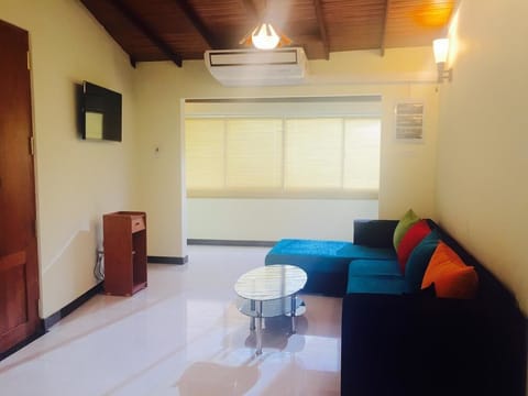 2-Bedroom Apartment | Living area | Flat-screen TV