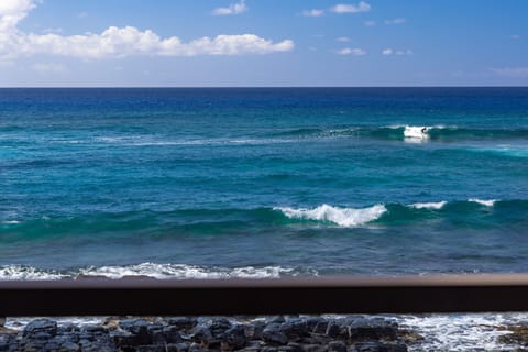 Hear the consistent roaring of the waves as you watch the surfers.