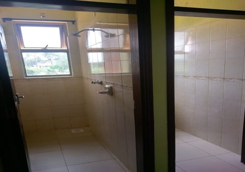 Family Apartment, Multiple Beds, Non Smoking | Bathroom | Shower, rainfall showerhead, free toiletries, slippers