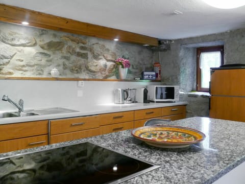 Countertop, Property, Room, Kitchen, Cabinetry, Interior Design, Furniture, Yellow, Tile, Sink