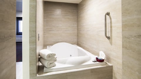 Suite, 1 King Bed | Bathroom | Shower, hair dryer, towels