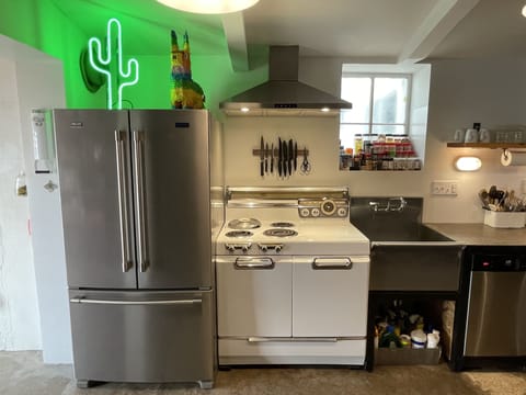 Deluxe Two-Queen Suite - Pets OK | Private kitchen | Fridge, microwave, oven, stovetop