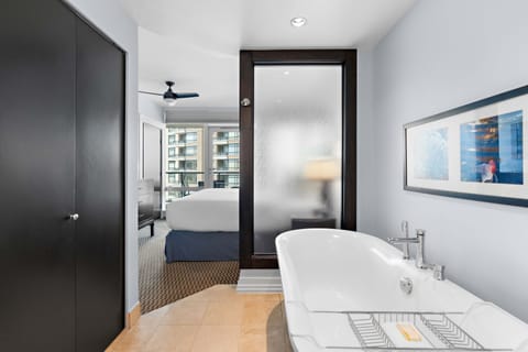 Luxury Suite, 1 Bedroom | Bathroom | Combined shower/tub, eco-friendly toiletries, hair dryer, bathrobes