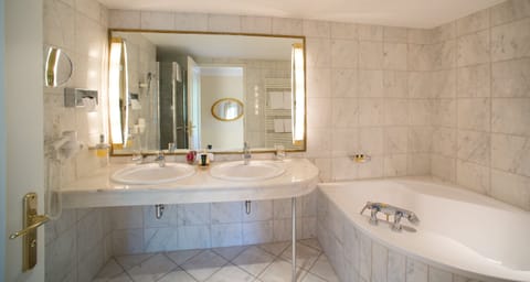 Designer toiletries, hair dryer, bathrobes, slippers