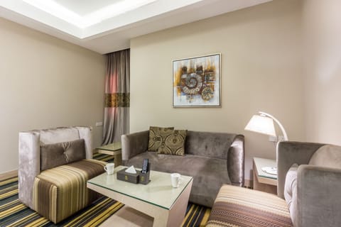 Suite, 1 Bedroom | Living area | Flat-screen TV