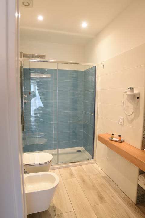 Double Room, 1 King Bed, Balcony | Bathroom | Shower, slippers, bidet, towels