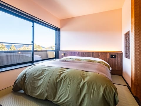 Japanese-Western QueenDouble Room 46 Sqm, Non Smoking (Separate guest room with open-air bath) | In-room safe, desk, laptop workspace, blackout drapes