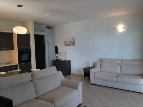 Deluxe Apartment, Sea View, Poolside | Living area | 40-inch Smart TV with satellite channels