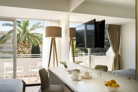 Classic Suite, Balcony, Sea View | Minibar, in-room safe, desk, blackout drapes