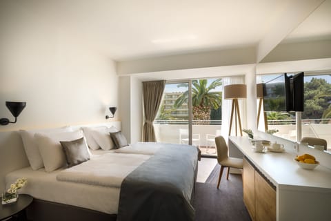 Classic Suite, Balcony, Sea View | Minibar, in-room safe, desk, blackout drapes