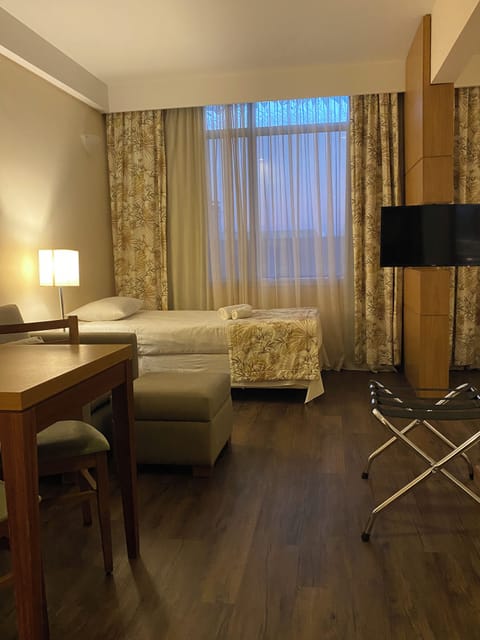 Superior Triple Room, 1 Bedroom | Minibar, in-room safe, desk, blackout drapes