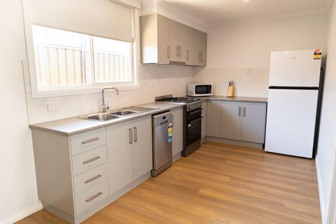 Apartment, 2 Bedrooms | Private kitchen | Fridge, microwave, coffee/tea maker, electric kettle