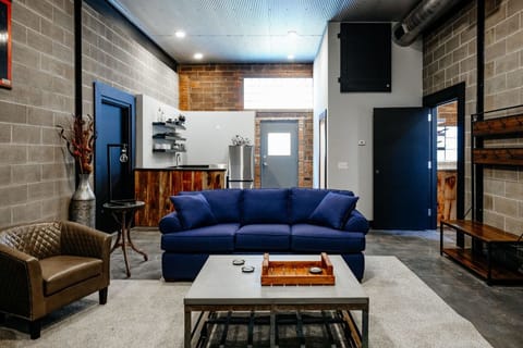 The Industrial, No Pets Allowed | Living area | Flat-screen TV