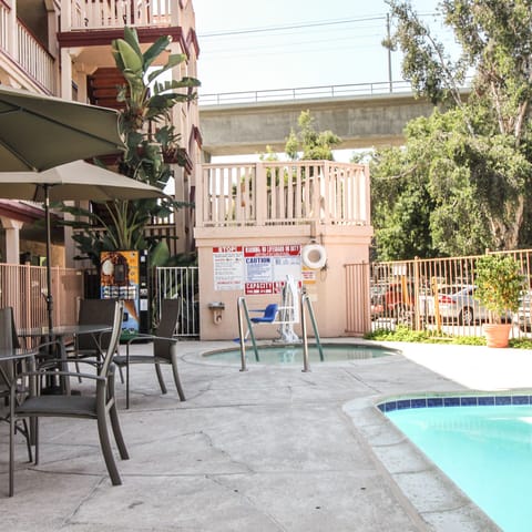 Outdoor pool, pool umbrellas, sun loungers