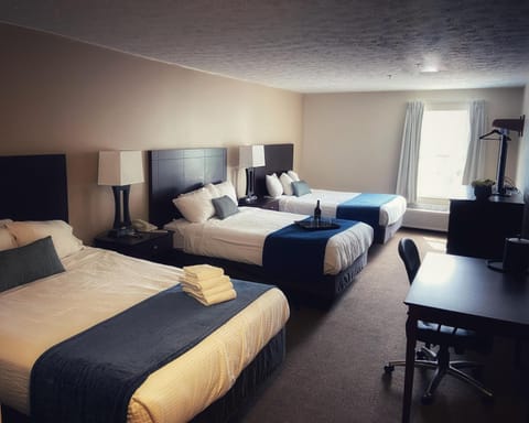 Suite (3 Queen Beds) | Desk, iron/ironing board, free WiFi, bed sheets