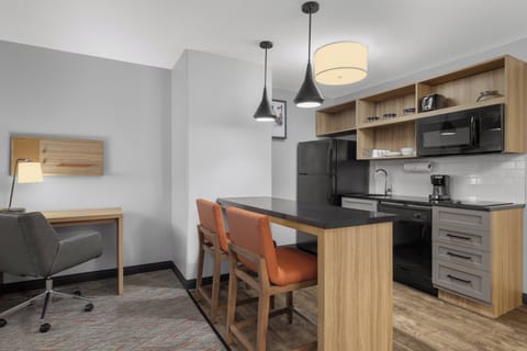 Suite, 1 Bedroom | Desk, blackout drapes, iron/ironing board, free WiFi