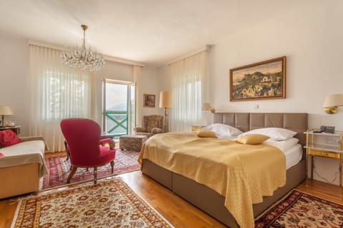 Junior Triple Room, Lake View | Hypo-allergenic bedding, minibar, in-room safe, individually furnished