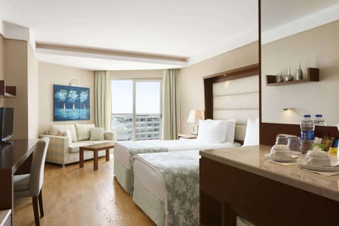 Deluxe Room, Side Sea View | Premium bedding, minibar, in-room safe, desk