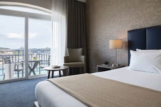 Superior Double or Twin Room, Sea View | Minibar, in-room safe, desk, laptop workspace