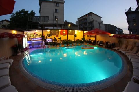 Seasonal outdoor pool, open 7 AM to midnight, pool umbrellas