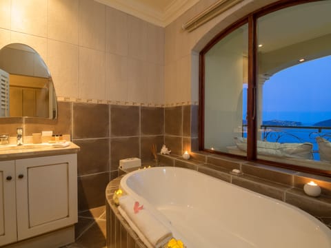 Luxury Suite, Lake View (Coral Suite) | Bathroom | Separate tub and shower, rainfall showerhead, hair dryer, bathrobes