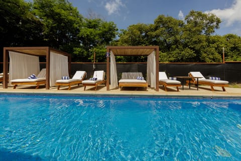 3 outdoor pools, open 7:00 AM to 7:00 PM, pool umbrellas