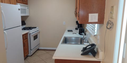 Standard Suite, 1 King Bed, Pool View | Private kitchen | Fridge, microwave, stovetop, dishwasher