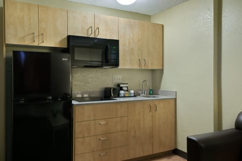 Extended Stay Queen Suite Kitchenette | Private kitchen | Fridge, coffee/tea maker