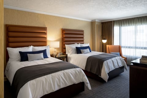 Premium bedding, down comforters, pillowtop beds, in-room safe